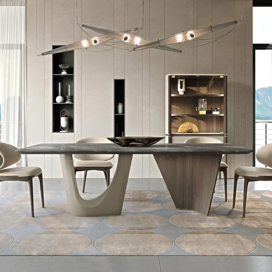 Distinguished Turri Pinnacle table with dark gray marble top and curved light beige with walnut wood base