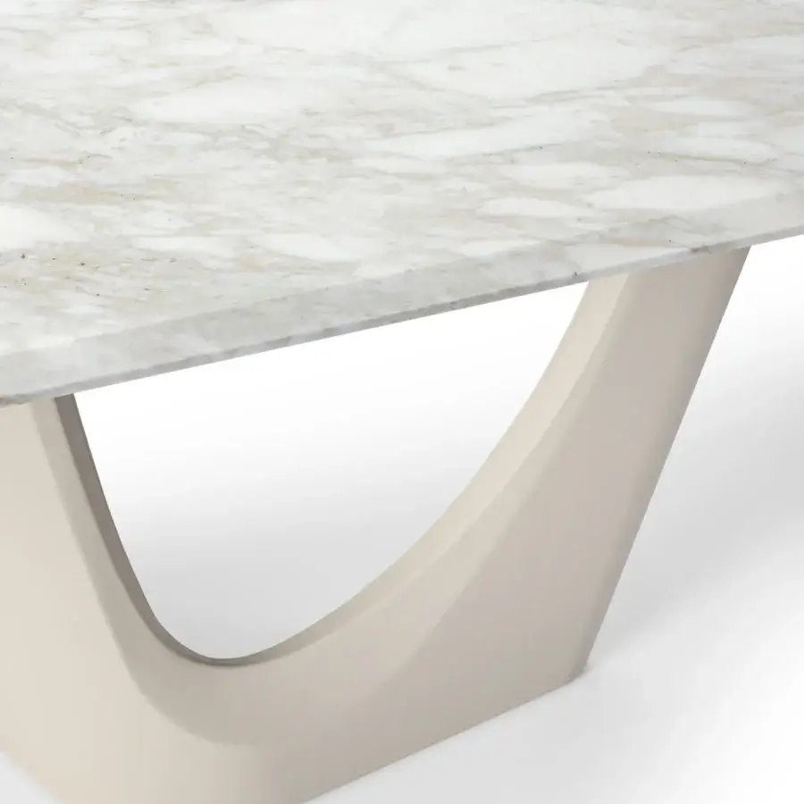 Distinguished Turri Pinnacle table with light beige marble top and curved matte finish pedestal base