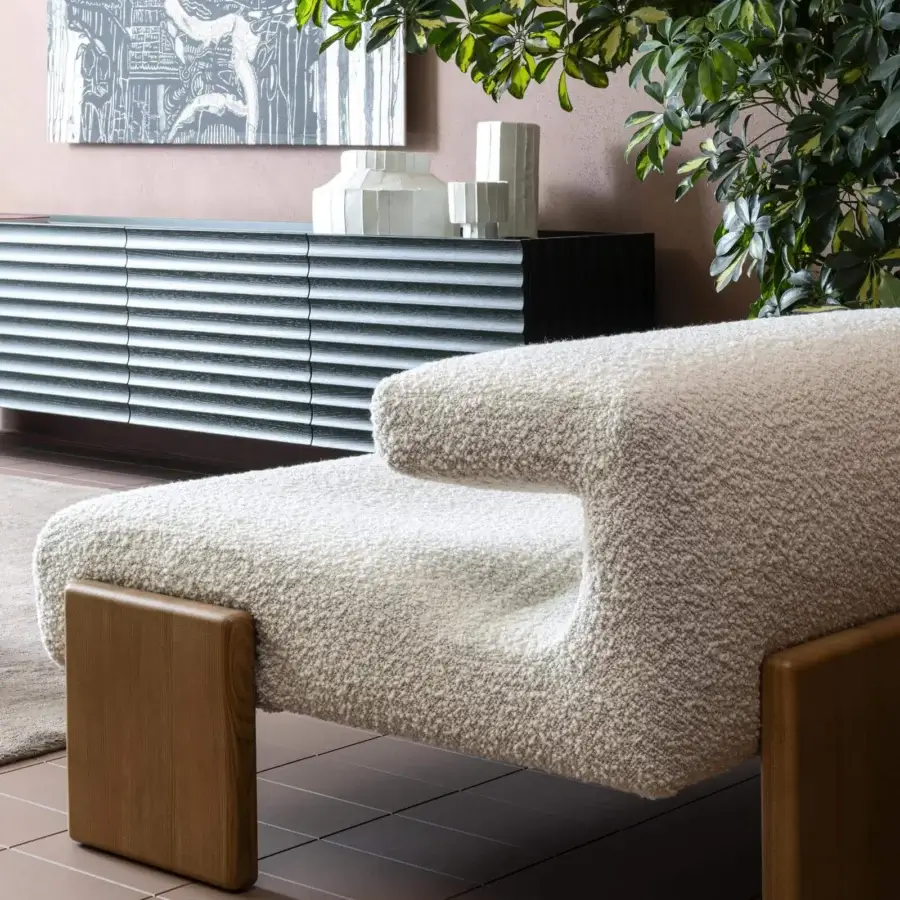 Lavish Moroso loveseat lounge chair in textured off-white textile with ash wood varnished feet crafted for modern spaces