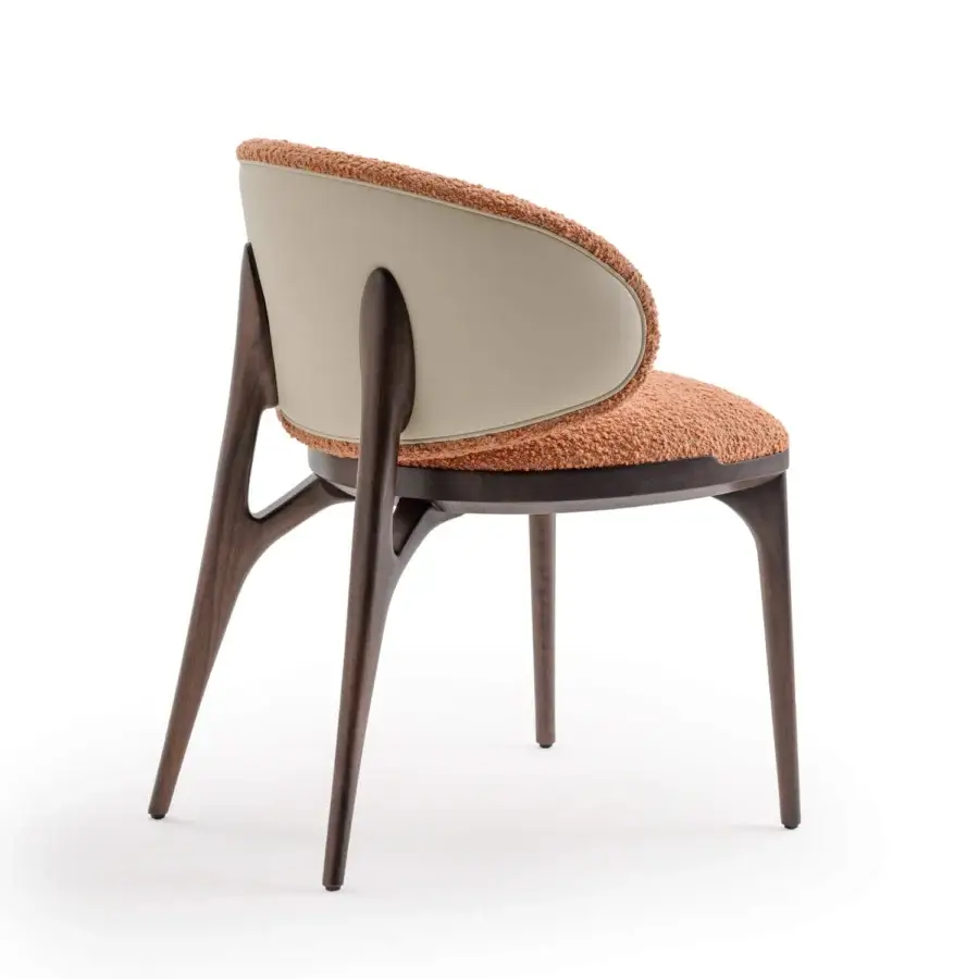 Superior Turri Pinnacle chair with dark wood, orange textile upholstery and light beige outer backrest