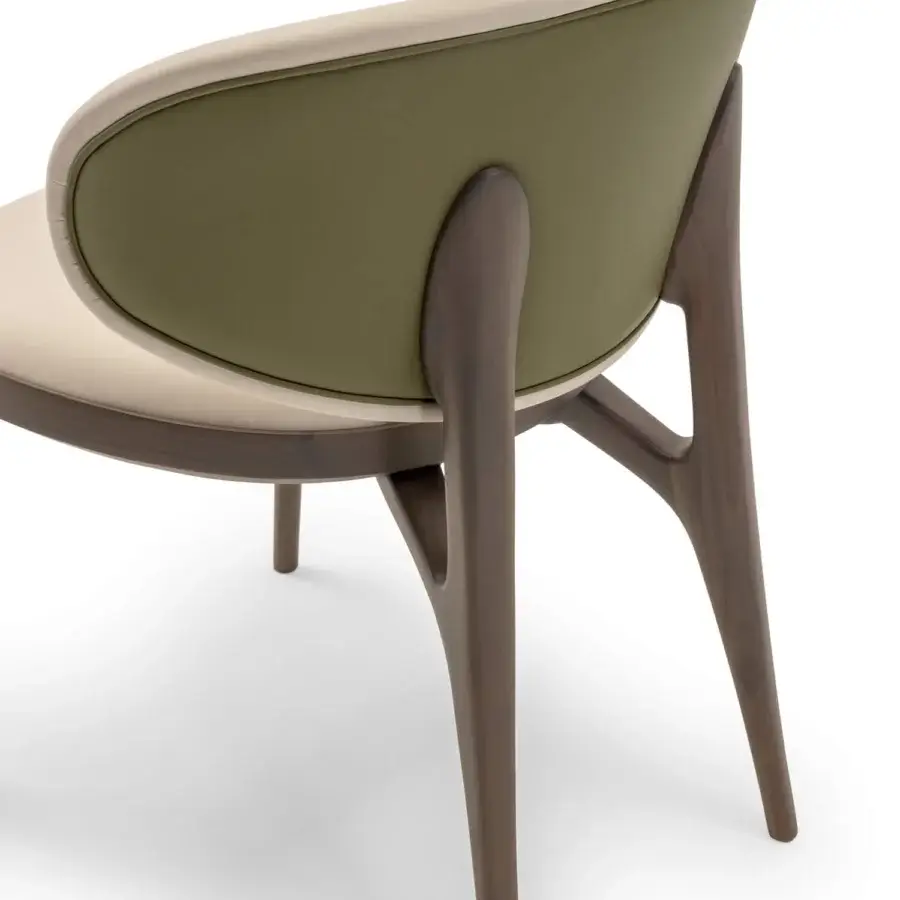 Superior Turri Pinnacle chair with curved silhouette upholstered in beige and olive green textiles with dark matte wood support