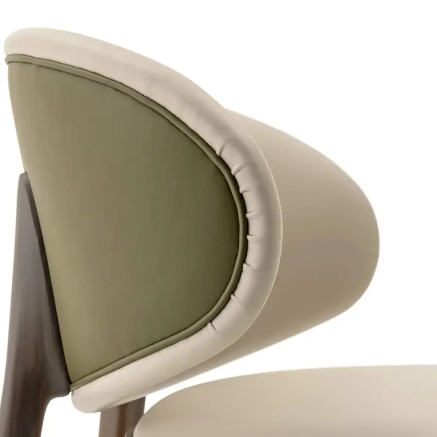 Harmonious Turri Pinnacle chair with wood structure and curved backrest upholstered in light beige textile with an olive green frame