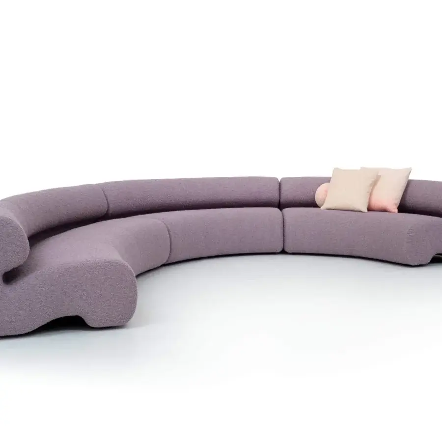 Superior Moroso Gruuve sofa with fluid lines upholstered in lavish muted lavender fabric and Polimex® base