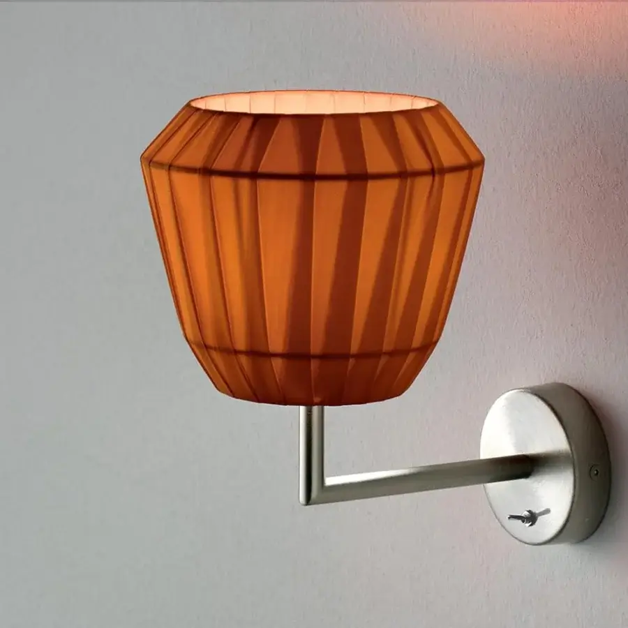 Captivating Modo Luce Loto wall lamp with a warm orange pleated fabric shade and brushed metal arm