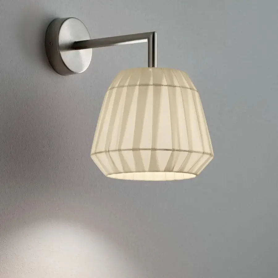 Distinguished Modo Luce Loto wall lamp with pleated fabric lampshade and matte silver-gray metal arm crafted in Italy