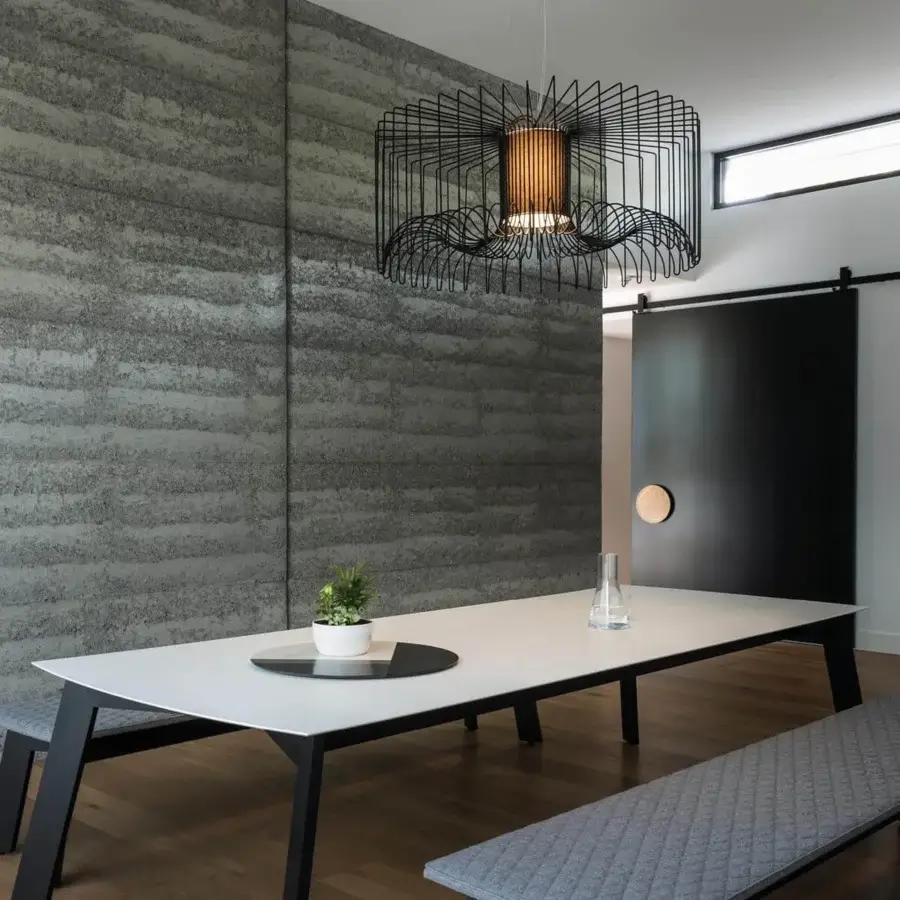 Elegant Modo Luce Icaro suspension lamp with geometric steel wire body in black matt finish and warmer central element