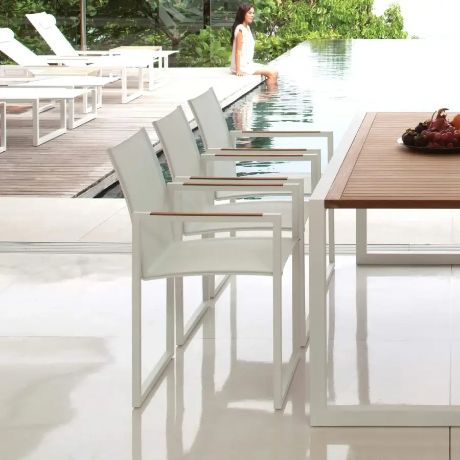 Distinguished Royal Botania Ninix armchair with white coated stainless steel frame and Batyline seat, built with wooden armrests