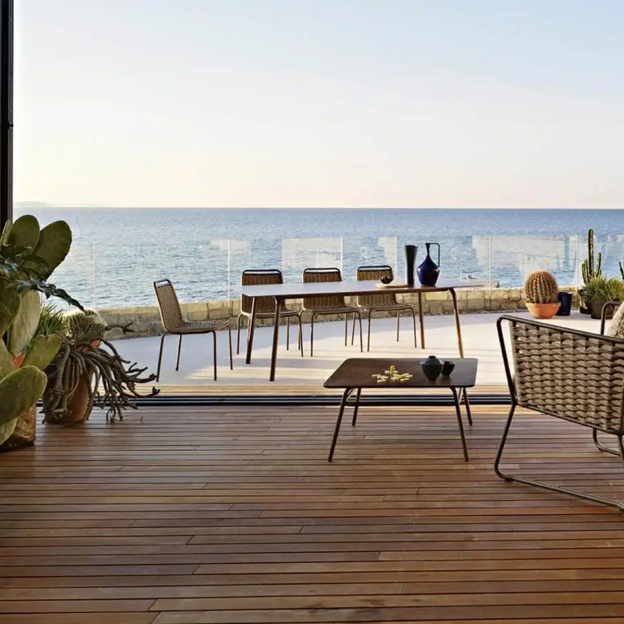 Elegant Roberti Rattan Portofino lounge chair with light brown woven Nautic Rope and dark powder-coated aluminum frame