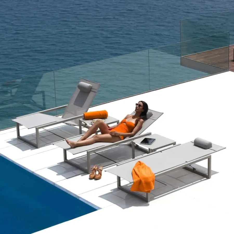 Superior Royal Botania Ninix lounger with a sleek stainless steel frame and comfortable Batyline seat in a cool gray palette
