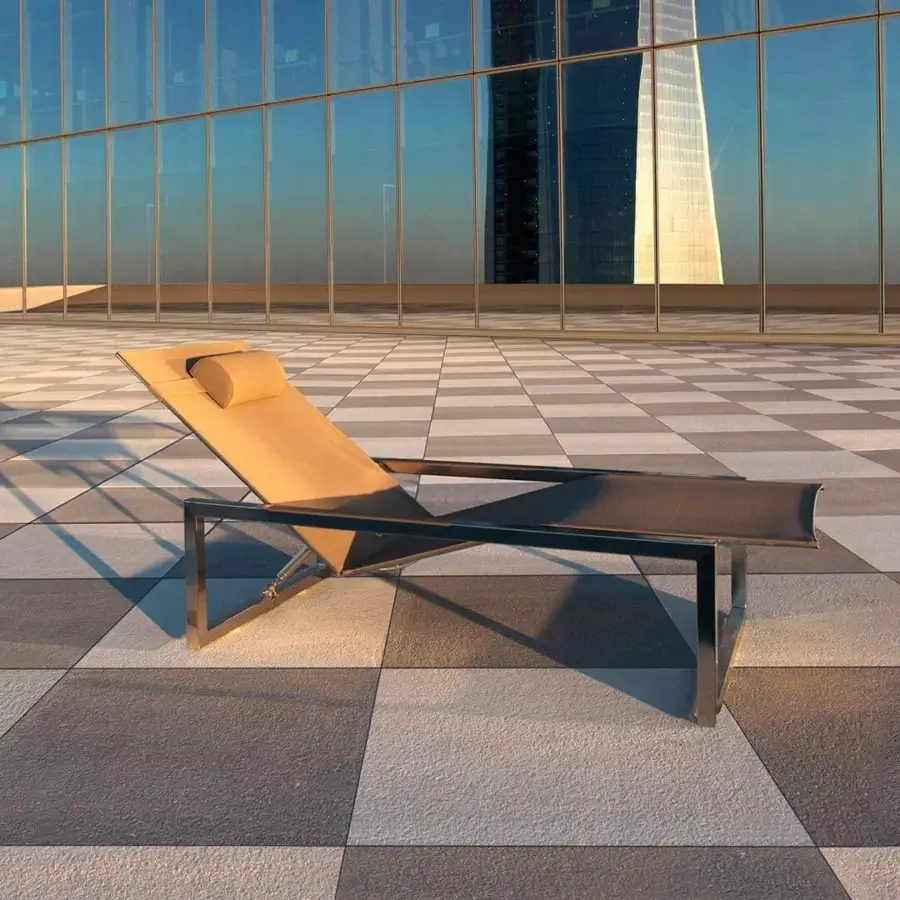 Superior Royal Botania Ninix lounger with a stainless steel frame and light tan Batyline seat, exhibiting a brushed metal finish