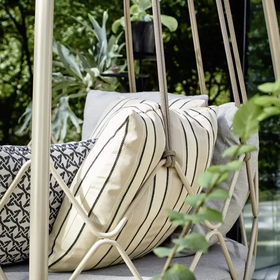 Distinguished Roberti Rattan Gravity lounge chair with powder-coated stainless steel interwoven with nautical rope and gray geometrically patterned cushions