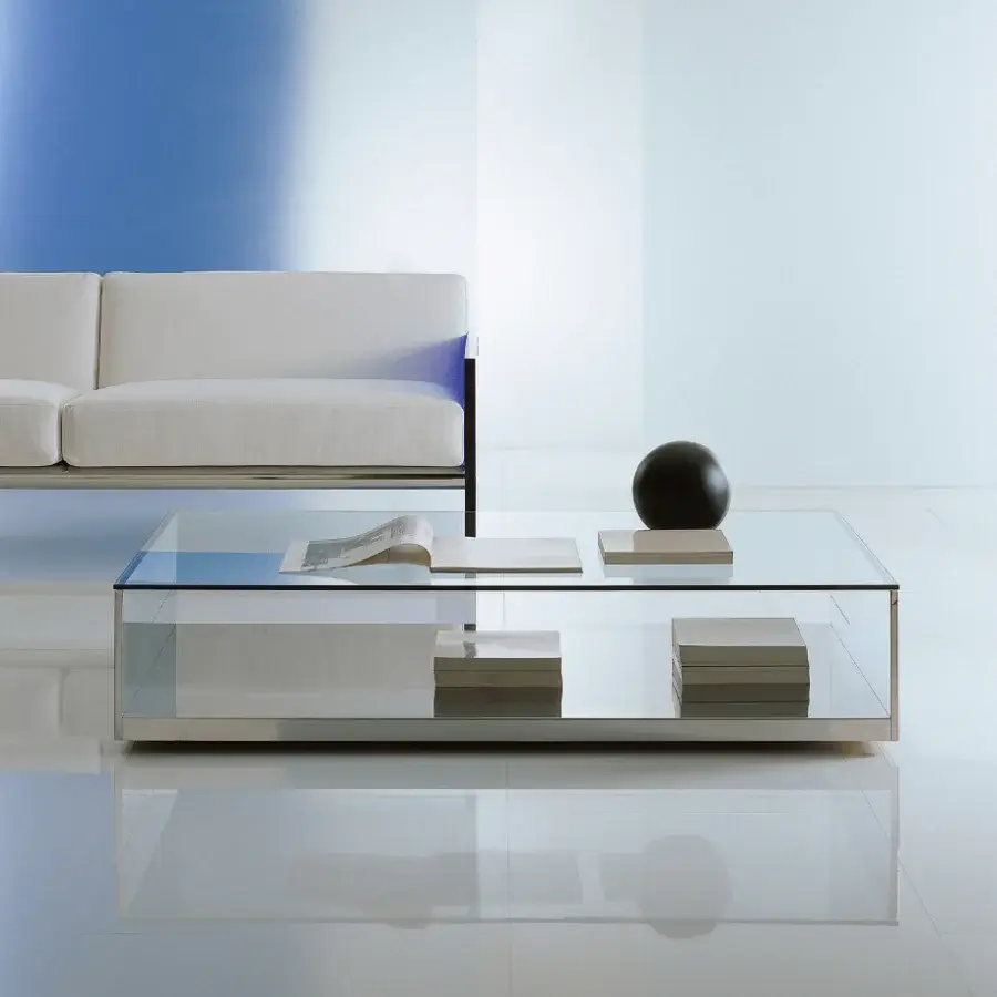 Elegant Acerbis Litt coffee table with a clear glass top and lower shelf in bright polished stainless steel