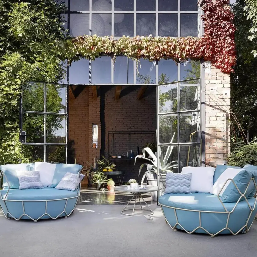 Exceptional Roberti Rattan Gravity lounge chair with light blue patterned cushions and powder coated stainless steel nautical rope structure