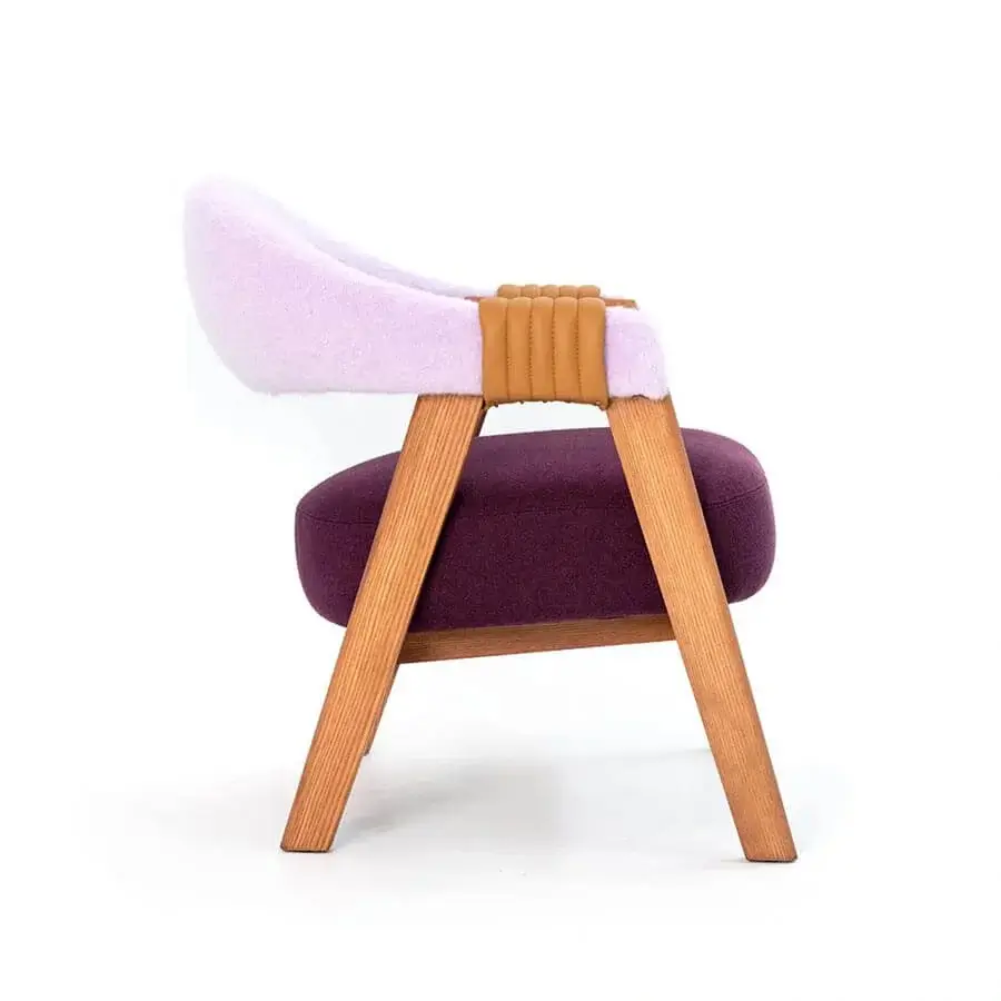 Exceptional Moroso Mathilda lounge chair with purple textiles, light brown wood structure and tan leather strap