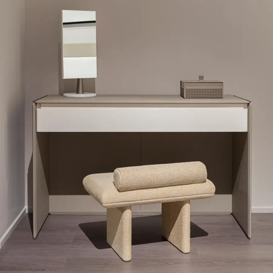 Sophisticated Turri Zero ottoman with textured light beige textile upholstery and cylindrical cushioned form
