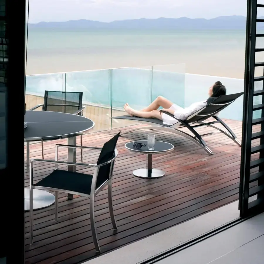 Distinguished Royal Botania O-Zon lounger with brushed stainless steel frame and black Batyline seat presents a sleek contemporary style