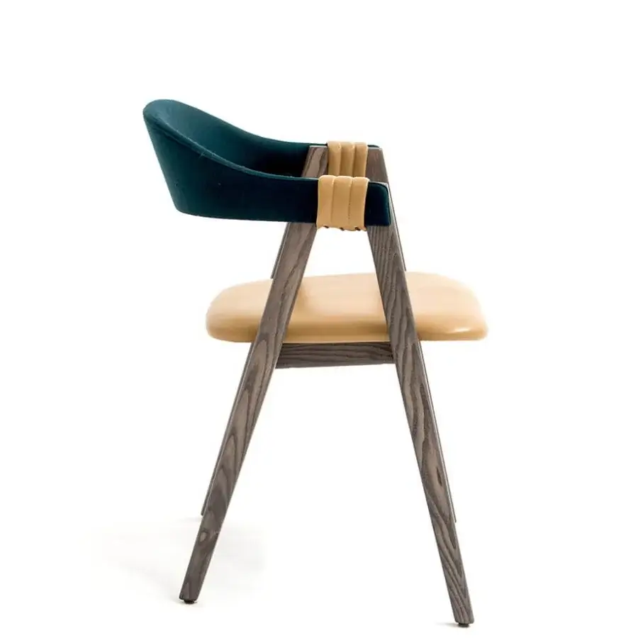 Architectural Moroso Mathilda armchair with dark teal fabric, light tan leather straps and a solid ash wood frame