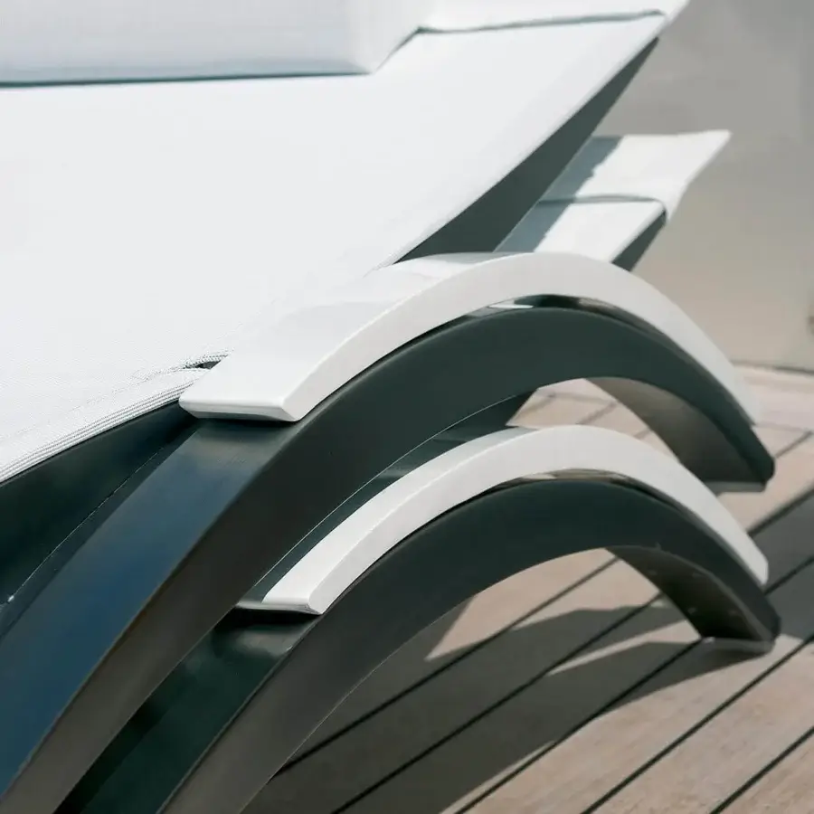 Elegant Royal Botania O-Zon lounger with bright white Batyline seat and brushed stainless steel frame