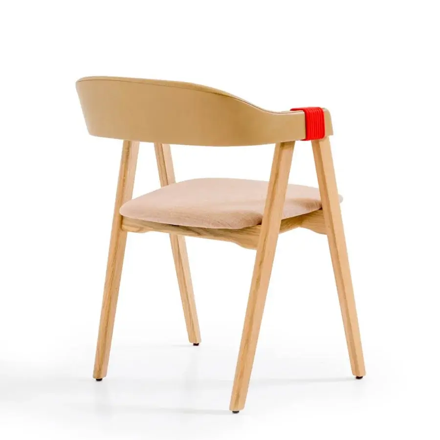 Innovative Moroso Mathilda armchair with light beige textile, matte ash wood and striking red detail