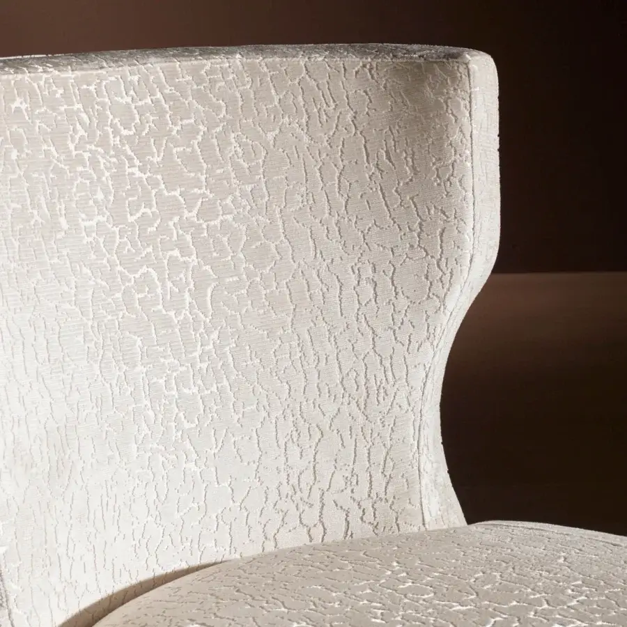 Lavish Bellavista Grace lounge chair upholstered in light cream textured fabric with curved multilayer Italian poplar wood legs