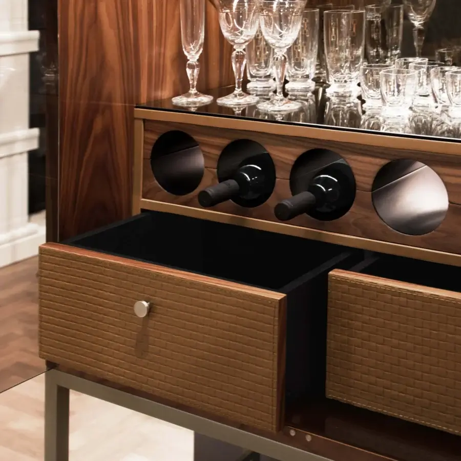 Exceptional Formitalia Jeffery cabinet with dark wood, woven brown drawers, metal base and internal glass shelving