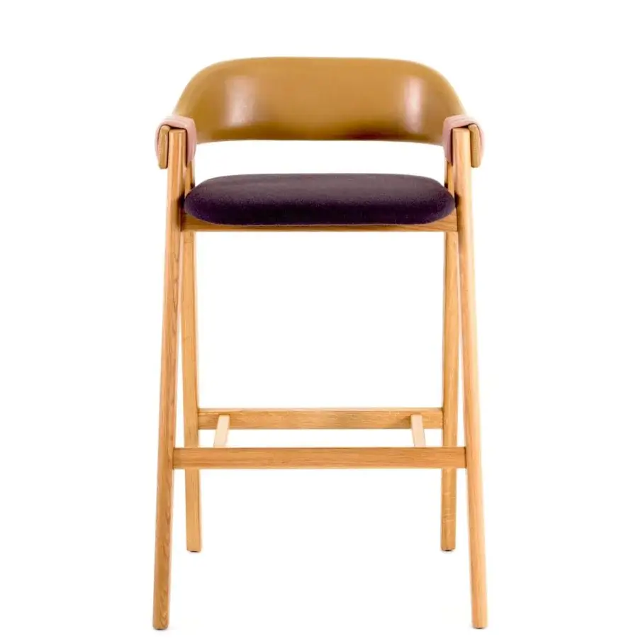 Innovative Moroso Mathilda stool with light wood, dark purple upholstery, and tan leather backrest