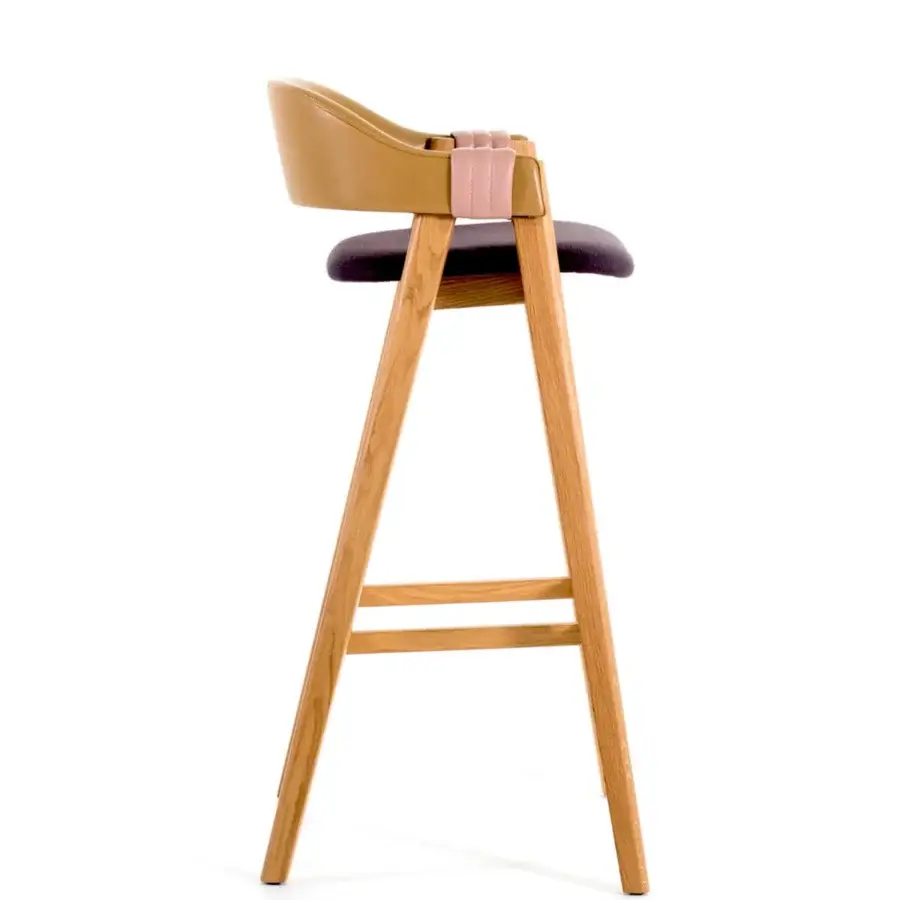 Distinguished Moroso Mathilda stool crafted with light-toned ash wood, dark upholstery, and a tan synthetic backrest with a pink strap