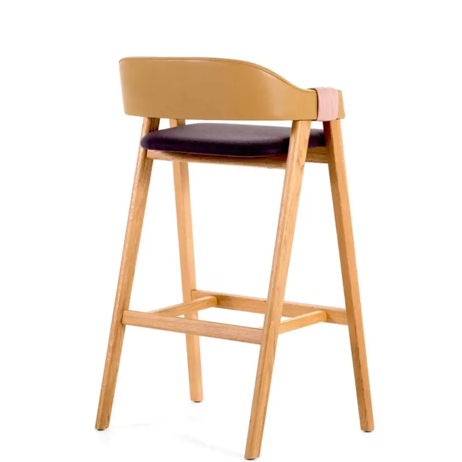 Architectural Moroso Mathilda stool built with light ash wood, dark fabric, and brown leather with pink strap detail