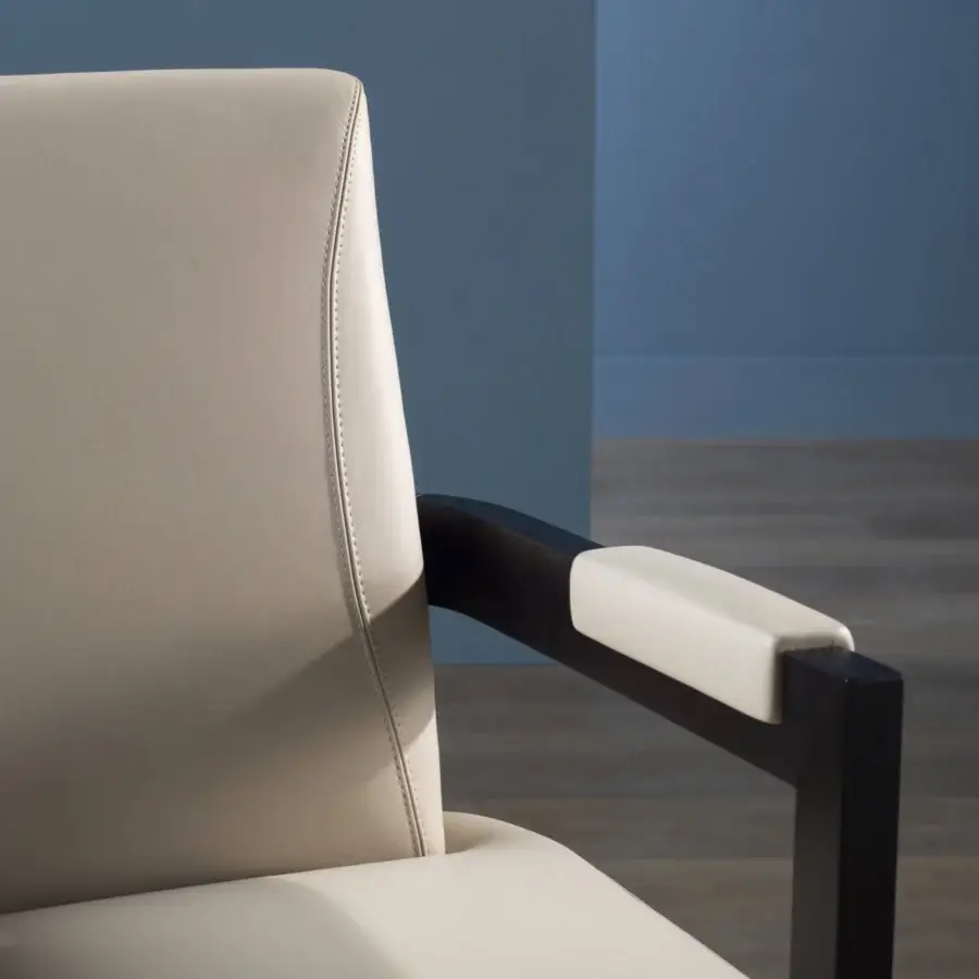 Exceptional Bellavista Bristol armchair upholstered in light cream fabric with quilting and dark beechwood legs