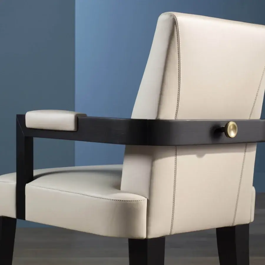 Distinguished Bellavista Bristol armchair with beechwood structure, light fabric cover, quilting and golden brass knob