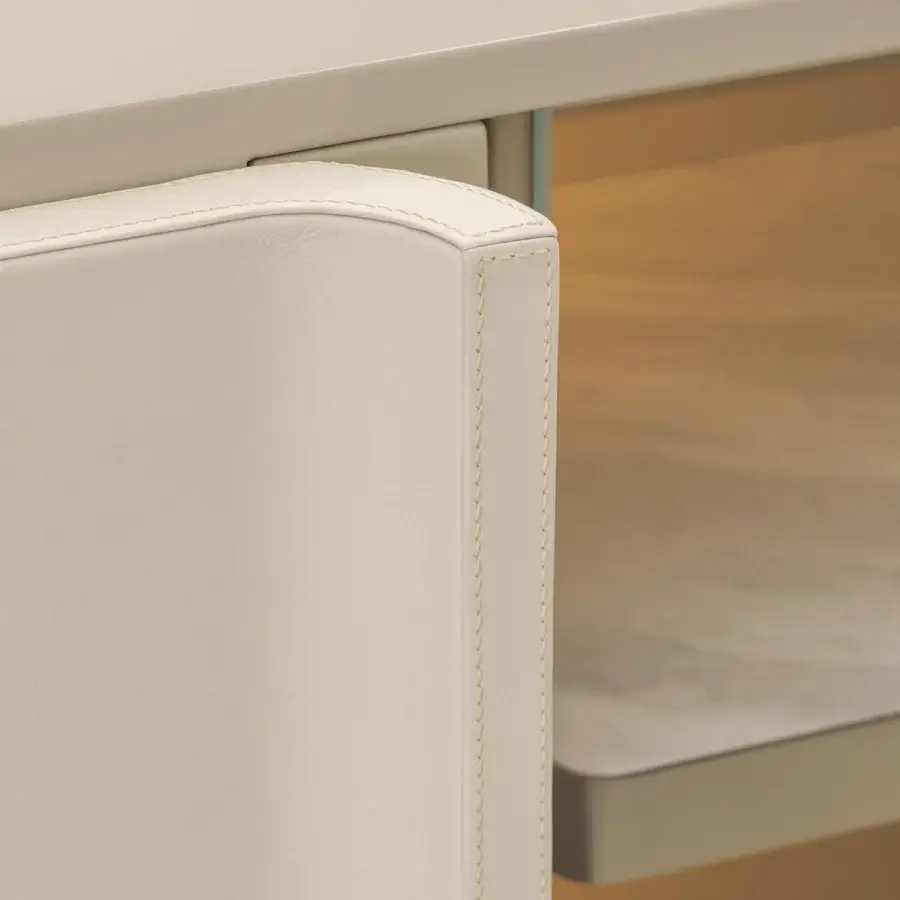 Elegant Turri Zero TV stand with light beige leather-coated doors and platinum finished satin metal feet