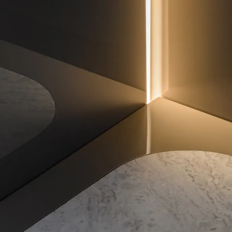Distinguished Turri Zero TV stand with stone-like surface, coated leather doors and satin platinum metal feet