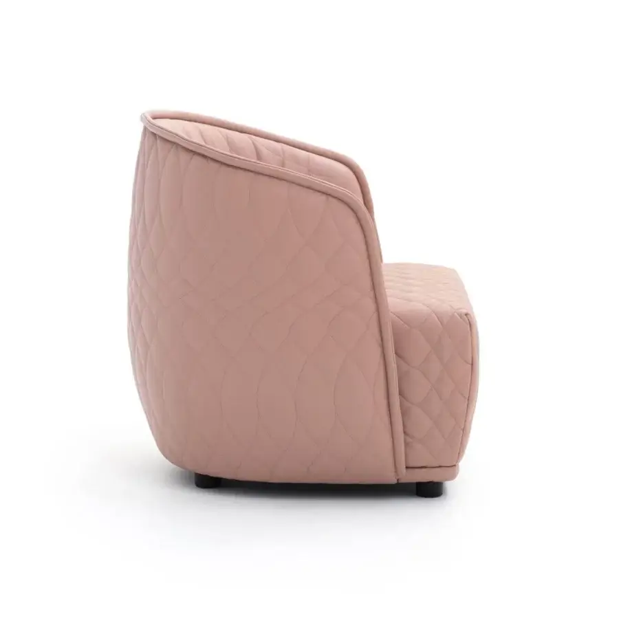 Superior Moroso Redondo lounge chair in light pink quilted textile with black polypropylene feet and soft matte finish