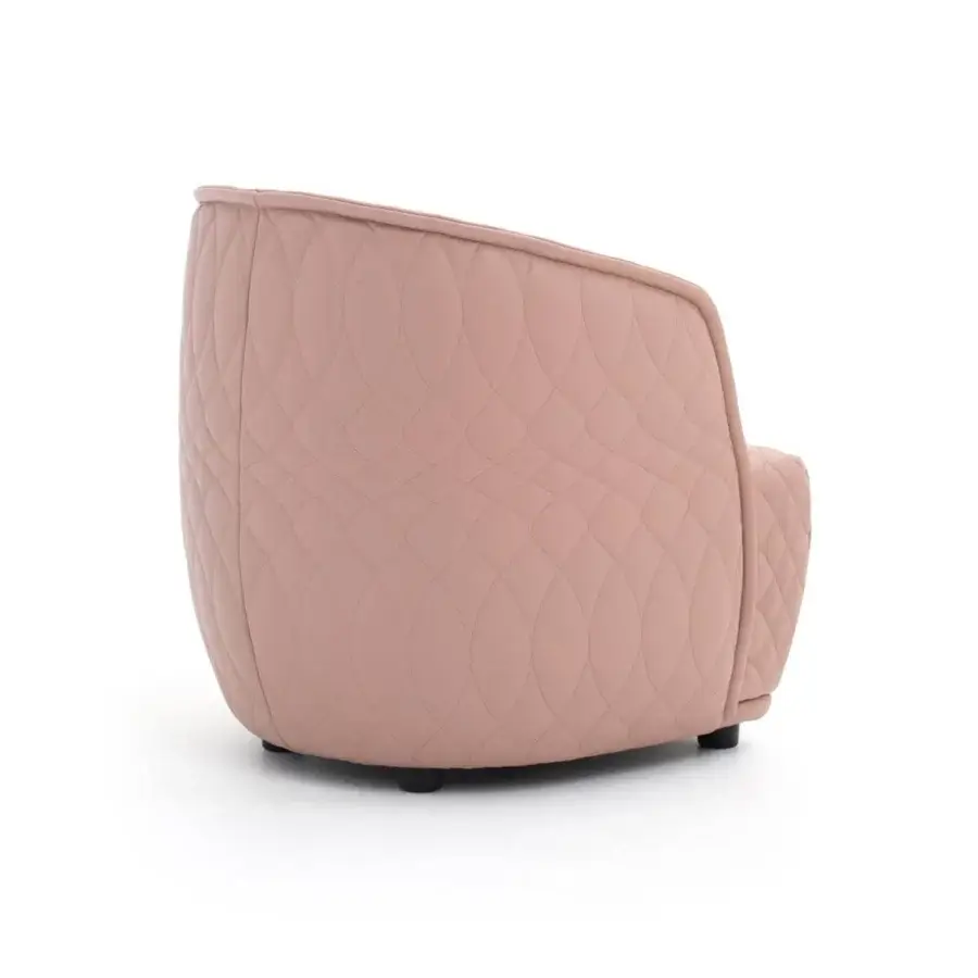 Refined Moroso Redondo lounge chair in muted pink quilted fabric with black polypropylene feet