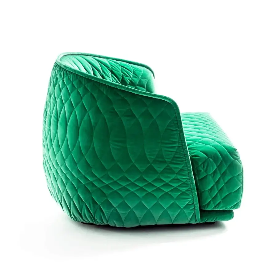 Distinctive Moroso Redondo lounge chair with vibrant green quilted upholstery and black polypropylene feet