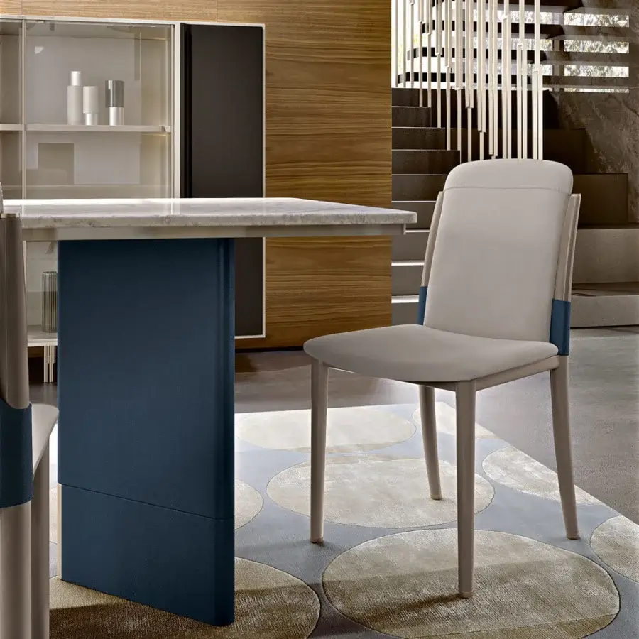 Distinguished Turri Zero table with refined Italian marble top and blue leather sculptural base with metal detail