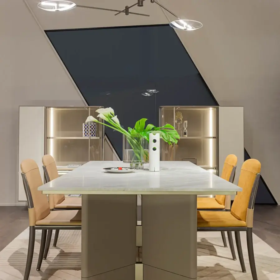 Distinguished Turri Zero table with light gray and white marble-like tabletop and brown-gray leather clad pedestals with gold accents