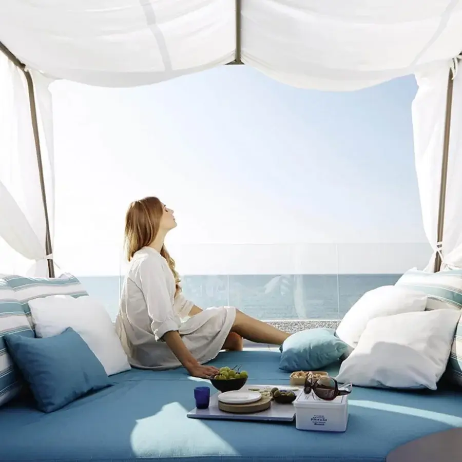 Lavish Roberti Rattan Portofino lounger with aluminum powder coating woven in blue and white nautic rope with cushions and canopy