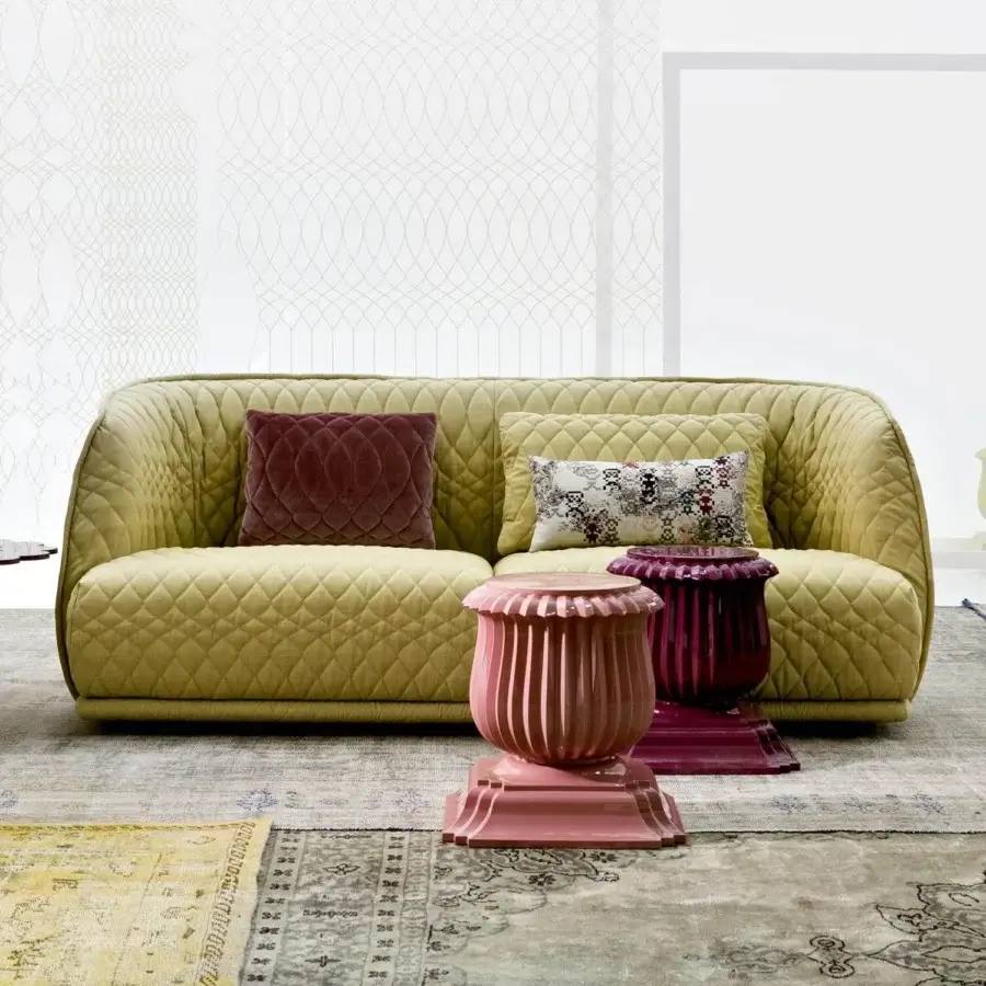 Distinctive Moroso Redondo sofa with quilted yellow-green fabric and curved lines, crafted in Italy with burgundy and patterned cushions