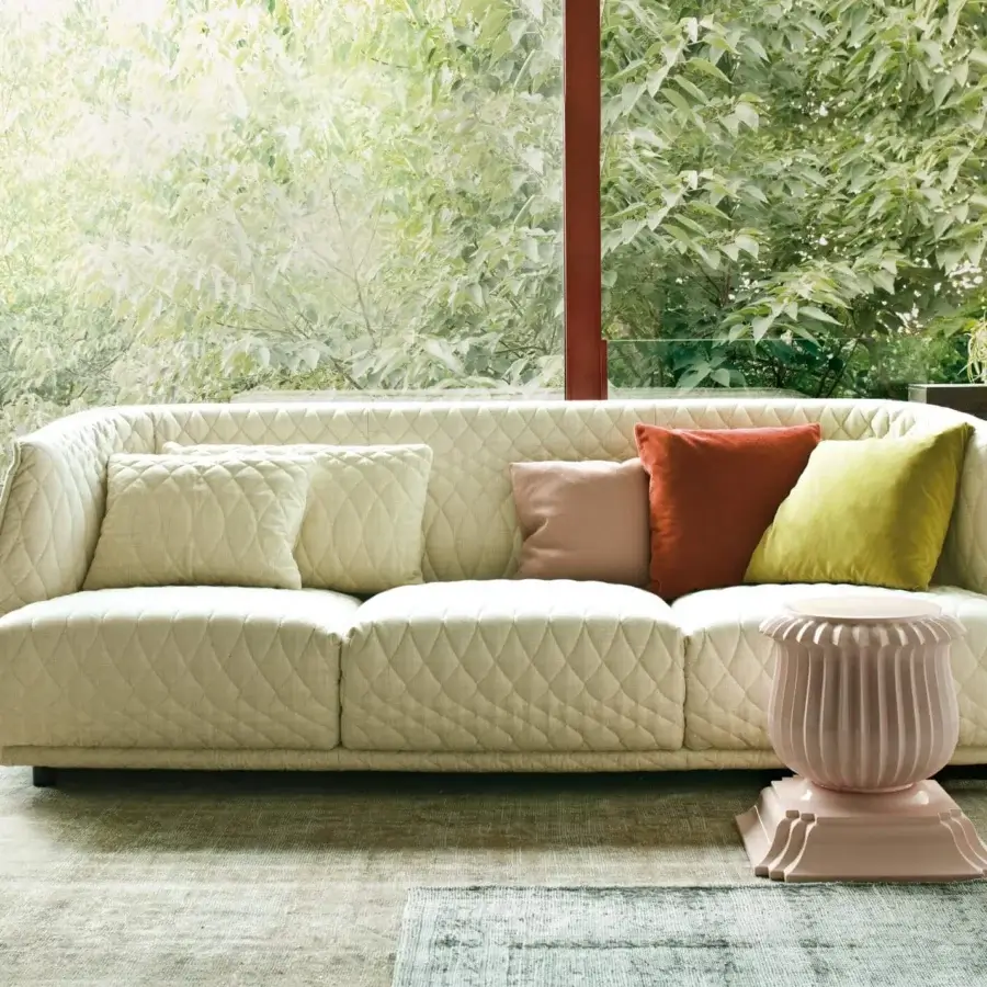 Sophisticated Moroso Redondo sofa with quilted light beige textile and black polypropylene feet, exhibiting Italian design