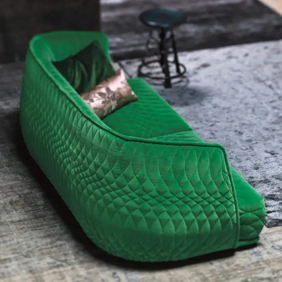 Elegant Moroso Redondo sofa with quilted green textile and black polypropylene feet crafted in Italy with included cushions
