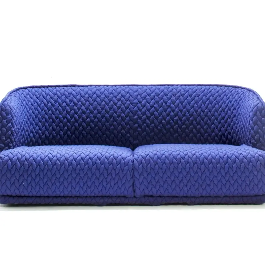 Distinguished Moroso Redondo sofa built in Italy with uniformly blue quilted textile and embracing padded shell