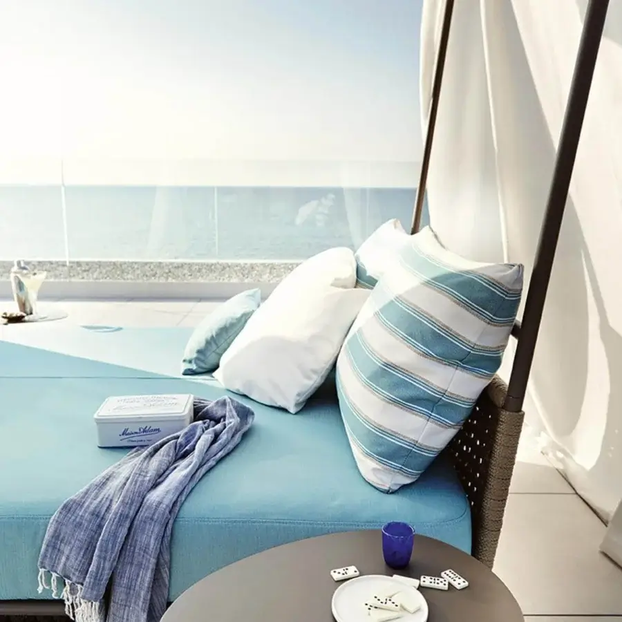 Distinguished Roberti Rattan Portofino lounger with powder-coated aluminum woven in nautic rope and plush blue cushions