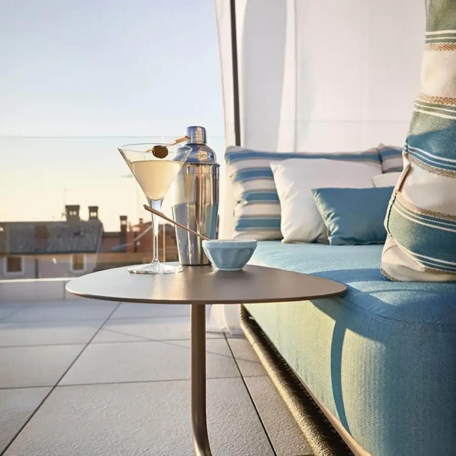 Lavish Roberti Rattan Portofino lounger with aluminum powder coating woven in nautic rope and light blue cushions beneath a white canopy