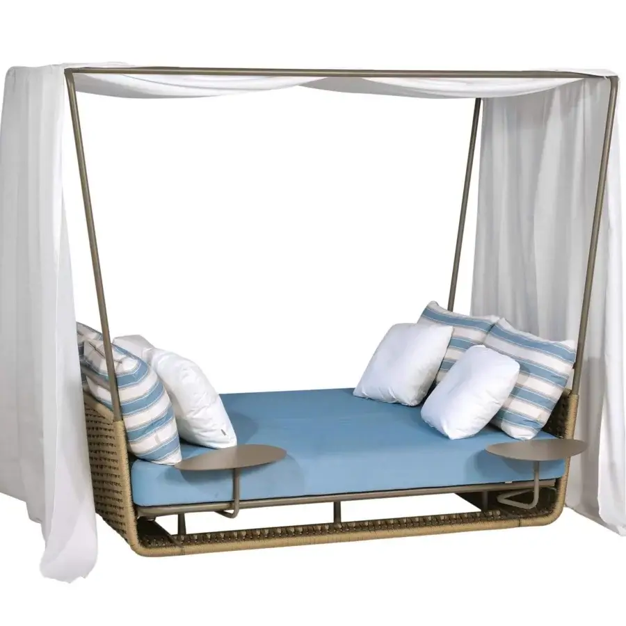 Exclusive Roberti Rattan Portofino lounger with aluminum woven in nautic rope, complemented by blue cushions and white drapes
