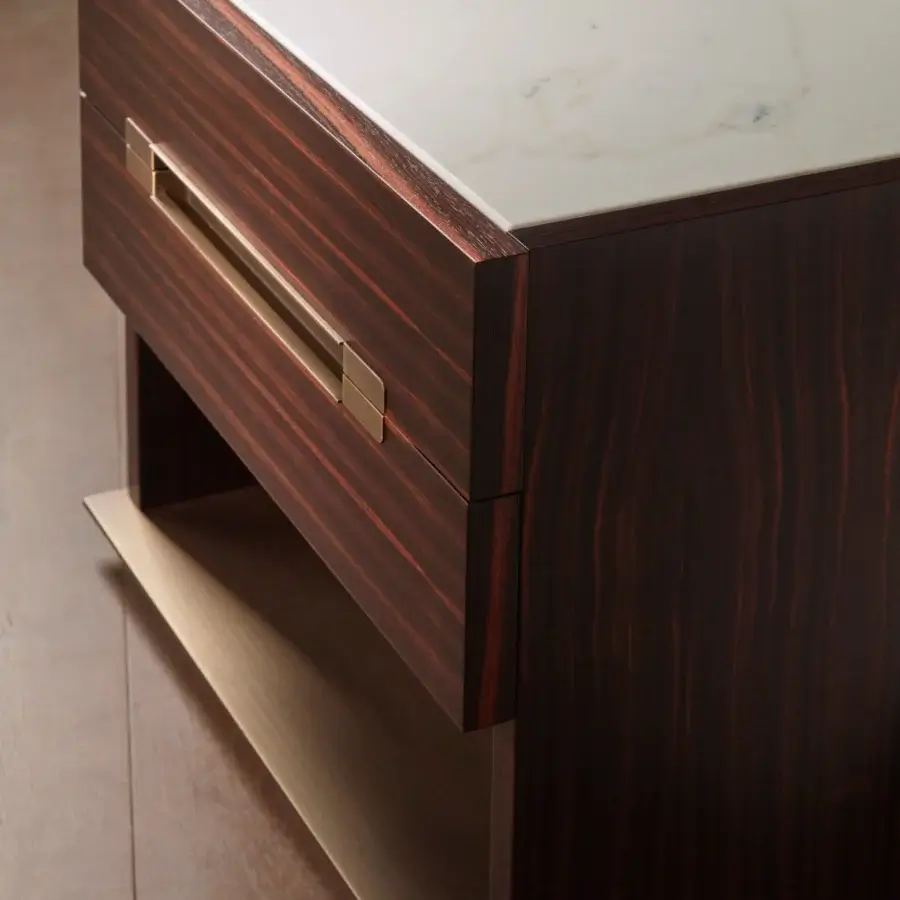 Elegant Bellavista Esencial nightstand built with European wood veneer in dark reddish-brown, a light marble top and brass handle