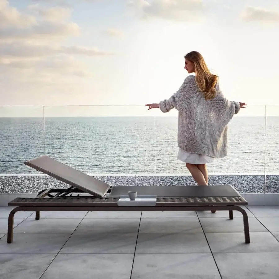 Elegant Roberti Rattan Portofino lounger with aluminum frame and Batyline surface woven in dark Nautic Rope