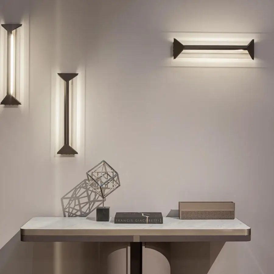Elegant Turri Zero console with light stone top and cylindrical base crafted in Italian leather with platinum accents