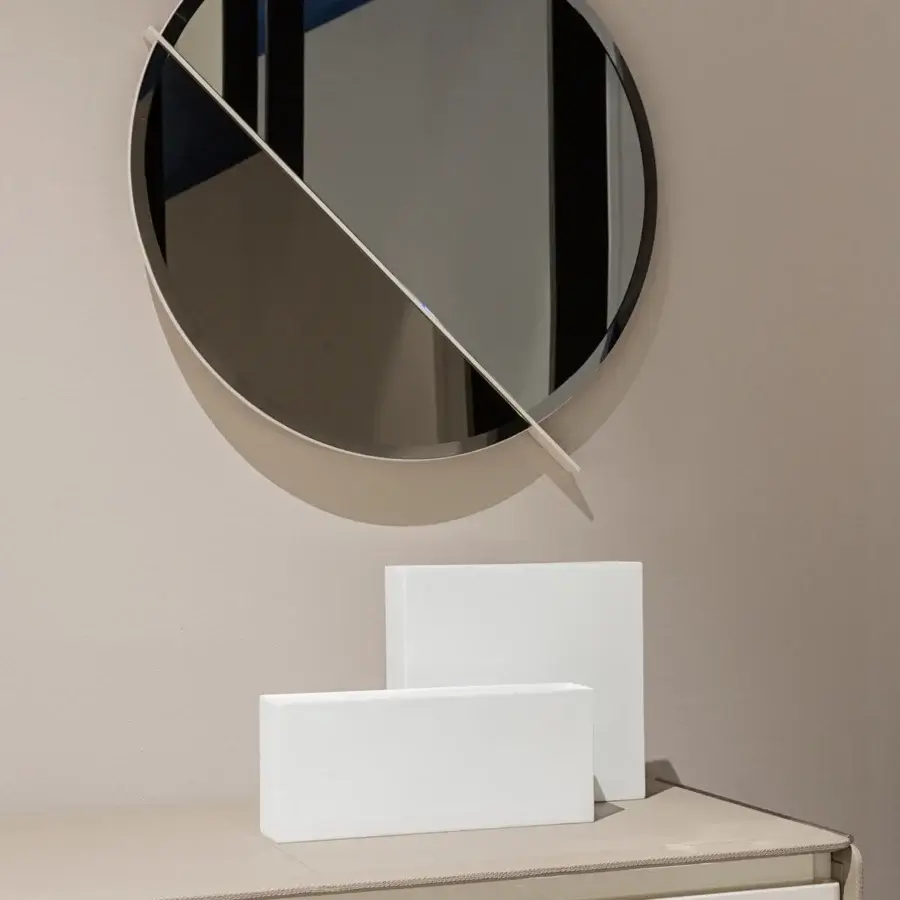 Superior Turri Zero mirror with a round glossy lacquered wooden structure and sleek metal bisecting a clear and bronzed reflection