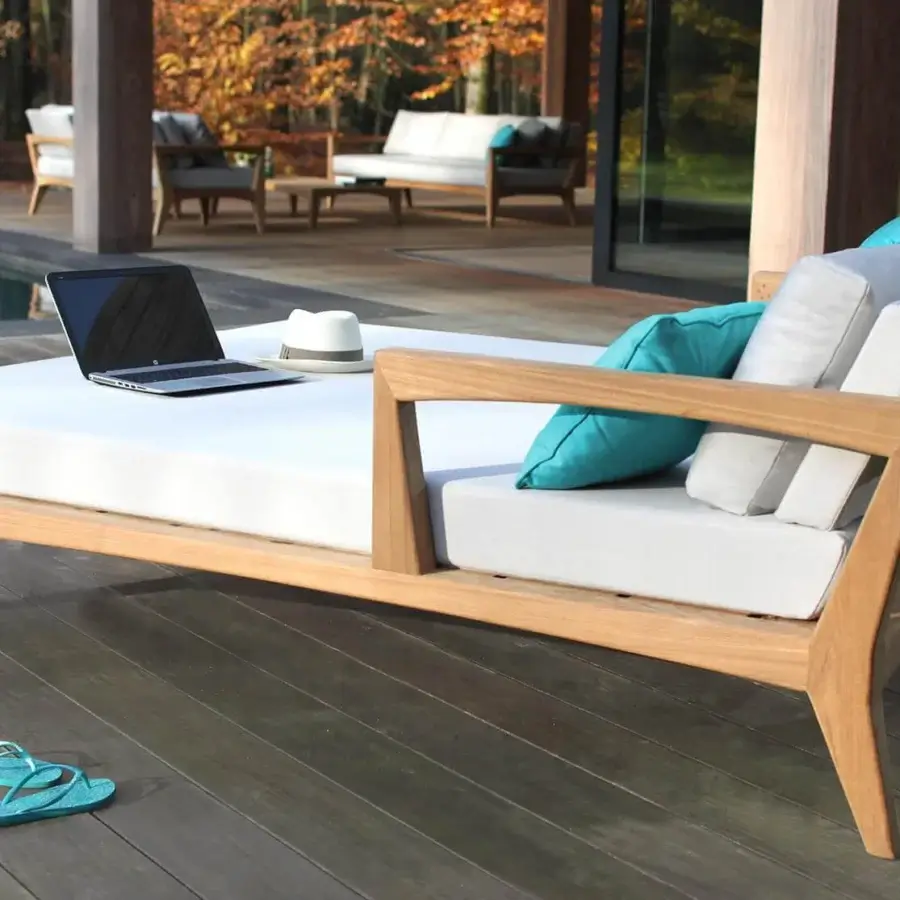 Distinguished Royal Botania Zenhit lounger with teak wood structure, off-white cushions and teal accents for serene outdoor relaxation